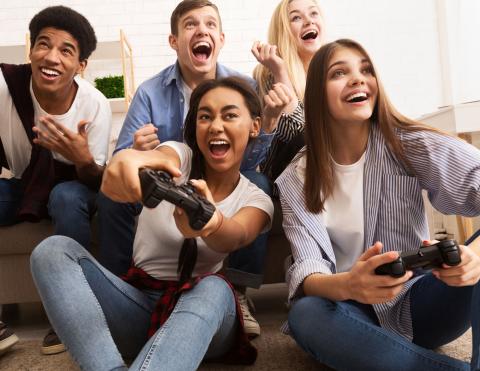 Teens playing a video game 