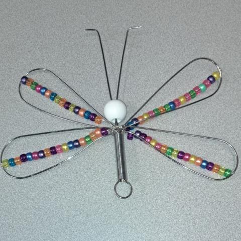 wire dragonfly with colorful beaded wings