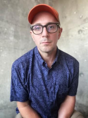 photo of Steve Burns with blue shirt and orange cap