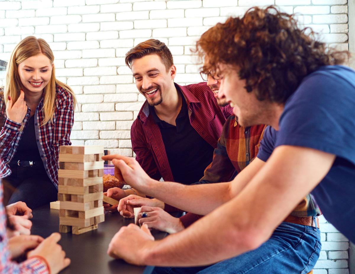 Teens playing Jenga